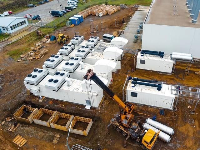 Modular units being craned into place on a construction site